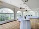 Elegant event space featuring round tables, floor-to-ceiling windows with picturesque outdoor views and bright, natural light at 10181 Holly Berry Dr, Weeki Wachee, FL 34613