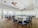 Bright event space with ample seating, round tables, and large windows, ideal for hosting gatherings and celebrations at 10181 Holly Berry Dr, Weeki Wachee, FL 34613