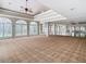 Spacious event space with high ceilings, arched windows, and ample natural light for a versatile and inviting atmosphere at 10181 Holly Berry Dr, Weeki Wachee, FL 34613