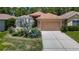 Charming single-Gathering home with well-manicured lawn and a two-car garage at 10181 Holly Berry Dr, Weeki Wachee, FL 34613