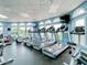 Bright gym featuring modern treadmills and equipment with views from large windows at 10181 Holly Berry Dr, Weeki Wachee, FL 34613
