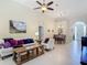 Open-concept living area showcasing tile floors and a view into the dining room at 10181 Holly Berry Dr, Weeki Wachee, FL 34613