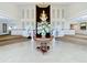 Grand lobby featuring a stunning chandelier and elegant decor, creating a welcoming atmosphere at 10181 Holly Berry Dr, Weeki Wachee, FL 34613