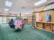 Bright pro shop with golf apparel, display racks, and a view of the entrance at 10181 Holly Berry Dr, Weeki Wachee, FL 34613