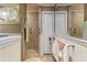 Bathroom featuring tiled shower and adjacent closet at 10267 Elgin Blvd, Spring Hill, FL 34608