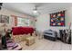 Cozy bedroom with tile floors, a window, and unique decor at 10267 Elgin Blvd, Spring Hill, FL 34608