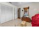 Bedroom with closet, tiled floors, and an adjacent doorway at 10267 Elgin Blvd, Spring Hill, FL 34608
