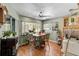 Cozy dining area features a dining table, ceiling fan, and natural light at 10267 Elgin Blvd, Spring Hill, FL 34608
