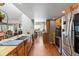 Spacious kitchen with stainless steel appliances, wood cabinets, and an open layout at 10267 Elgin Blvd, Spring Hill, FL 34608