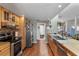 Modern kitchen features stainless steel appliances and wood cabinetry at 10267 Elgin Blvd, Spring Hill, FL 34608
