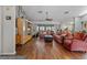 Spacious living room with hardwood floors, comfortable seating, and an open layout at 10267 Elgin Blvd, Spring Hill, FL 34608