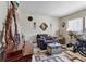 Cozy living room featuring a brown sofa, a decorative mirror, and a stylish coffee table at 10267 Elgin Blvd, Spring Hill, FL 34608