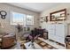 Comfortable living room area filled with natural light from a window, enhancing its cozy charm at 10267 Elgin Blvd, Spring Hill, FL 34608