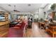 Open-concept living room featuring wood floors, comfortable seating, and natural light at 10267 Elgin Blvd, Spring Hill, FL 34608