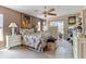 Bedroom with stylish decor, a ceiling fan, and a window overlooking the yard at 10267 Elgin Blvd, Spring Hill, FL 34608