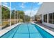 Inviting pool inside a screened enclosure, offering privacy and an unobstructed view of the outdoors at 10267 Elgin Blvd, Spring Hill, FL 34608