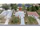 This aerial view highlights the property's location in a quiet neighborhood with fenced backyard and mature landscaping at 10386 Myra St, Spring Hill, FL 34608