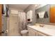 Well-maintained bathroom featuring a shower with glass doors, modern vanity, and coordinated fixtures at 10386 Myra St, Spring Hill, FL 34608