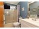 Cozy bathroom showcasing a shower with glass doors, modern vanity, and coordinated fixtures at 10386 Myra St, Spring Hill, FL 34608