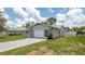 Charming home with a well-maintained lawn, driveway, and attached garage at 10386 Myra St, Spring Hill, FL 34608