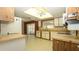 Bright kitchen with abundant cabinetry, modern appliances, and a ceiling fan at 10386 Myra St, Spring Hill, FL 34608