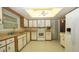 Functional kitchen with white appliances, wood-look countertops, and easy access to the Florida Room at 10386 Myra St, Spring Hill, FL 34608