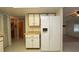 Bright kitchen with white cabinets, countertops, and a large refrigerator with water and ice dispenser at 10386 Myra St, Spring Hill, FL 34608