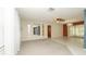 Spacious living room with carpet, tile, and lots of natural light at 10386 Myra St, Spring Hill, FL 34608