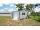 Storage shed provides extra storage for tools and equipment in the backyard at 10386 Myra St, Spring Hill, FL 34608