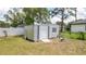 Backyard shed with a door and window offers ample outdoor storage at 10386 Myra St, Spring Hill, FL 34608