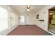 Bright sunroom features carpeted floors, neutral walls, and a ceiling fan at 10386 Myra St, Spring Hill, FL 34608