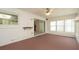 Bright sunroom features carpeted floors, neutral walls, and sliding glass doors at 10386 Myra St, Spring Hill, FL 34608