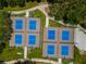 Aerial view of neighborhood pickleball courts, showcasing community recreational spaces at 111 E Cedar St, Tarpon Springs, FL 34689