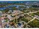 Community aerial view of a neighborhood surrounded by water, commercial properties and roadways at 111 E Cedar St, Tarpon Springs, FL 34689