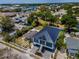An aerial view of a modern two-story home showcasing its front porch and proximity to local amenities at 111 E Cedar St, Tarpon Springs, FL 34689
