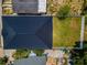 Drone eye view showcasing the architectural details of the roof and the well-manicured backyard space at 111 E Cedar St, Tarpon Springs, FL 34689