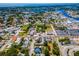 A wide-angle shot showcases the property, local streets, and the surrounding neighborhood's layout at 111 E Cedar St, Tarpon Springs, FL 34689