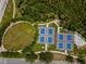 Aerial view of well-maintained community park featuring pickleball courts and green spaces at 111 E Cedar St, Tarpon Springs, FL 34689