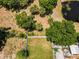 A top-down aerial view of the manicured backyard, featuring lush green grass and landscaping details at 111 E Cedar St, Tarpon Springs, FL 34689