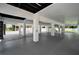 Open-air garage offers ample space with supporting columns and modern lighting at 111 E Cedar St, Tarpon Springs, FL 34689