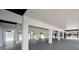 Bright open garage with a smooth concrete floor, clean lines, and modern design at 111 E Cedar St, Tarpon Springs, FL 34689