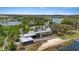Stunning lakefront clubhouse featuring modern architecture, ample parking, and scenic water views at 11398 Juglans Dr, Odessa, FL 33556