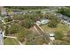 Aerial view of the neighborhood amenity center featuring a pool, walking trails, and a covered picnic area at 11398 Juglans Dr, Odessa, FL 33556
