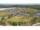 Wide aerial shot featuring multiple baseball fields, parking lots, and green spaces at 11398 Juglans Dr, Odessa, FL 33556