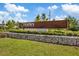 Starkey Ranch community entrance sign with stone base and lush landscaping under a blue sky at 11398 Juglans Dr, Odessa, FL 33556