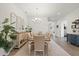 Formal dining room with stylish decor, ample seating, and elegant lighting, ideal for hosting dinner parties at 11398 Juglans Dr, Odessa, FL 33556