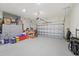 Spacious three-car garage with ample storage space and an automatic door opener at 11398 Juglans Dr, Odessa, FL 33556