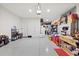Spacious garage with epoxy floors provides ample storage and workspace at 11398 Juglans Dr, Odessa, FL 33556