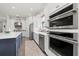 Bright kitchen boasts stainless appliances and an island with seating at 11398 Juglans Dr, Odessa, FL 33556