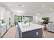 Contemporary kitchen with a large island overlooking the living room, perfect for entertaining and Gathering gatherings at 11398 Juglans Dr, Odessa, FL 33556